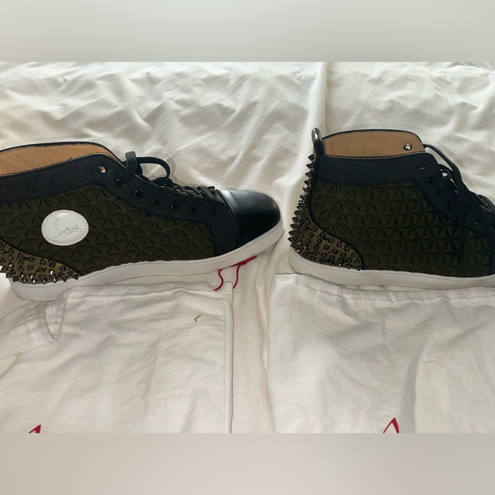 Christian Louboutin rare spiked sneakers/original box & dust bags. Worn once.